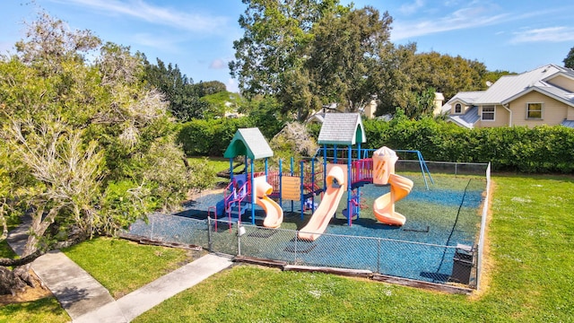 view of jungle gym with a lawn