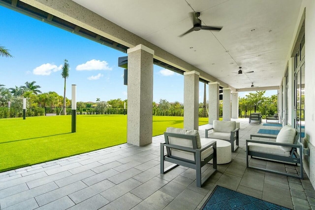 view of patio featuring an outdoor hangout area and ceiling fan