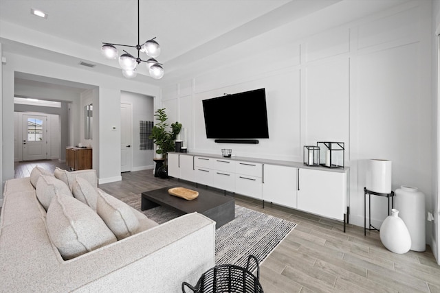 living room featuring a chandelier