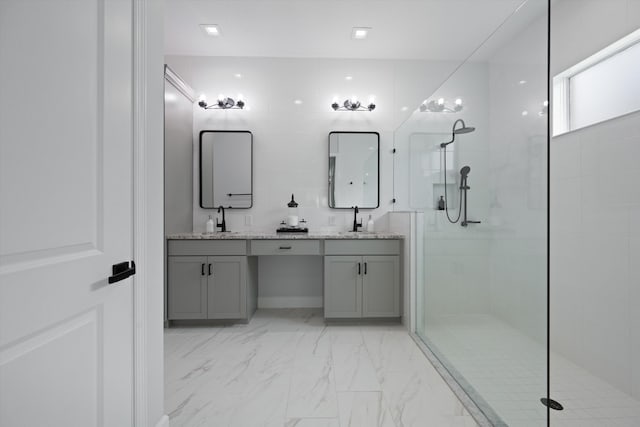 bathroom with vanity and tiled shower