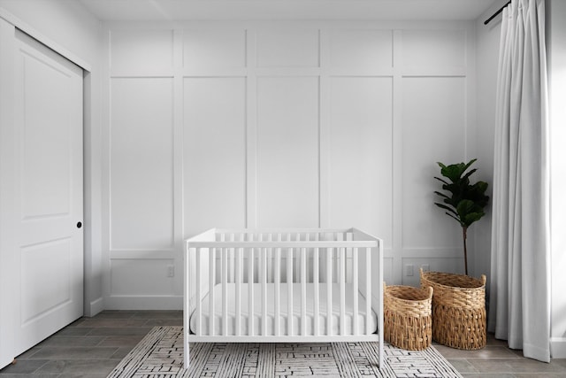 bedroom with a closet and a crib