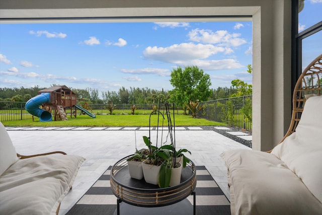 view of patio with a playground and an outdoor living space