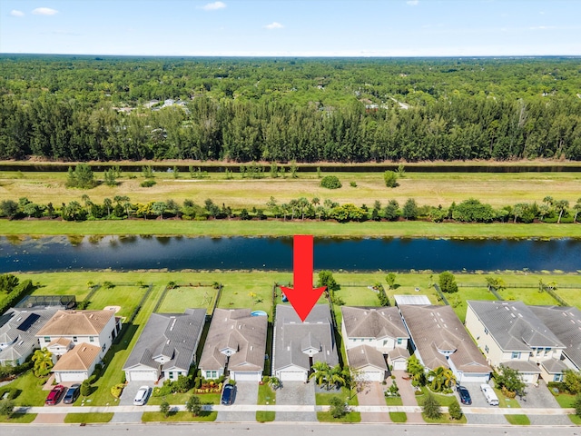 birds eye view of property with a water view