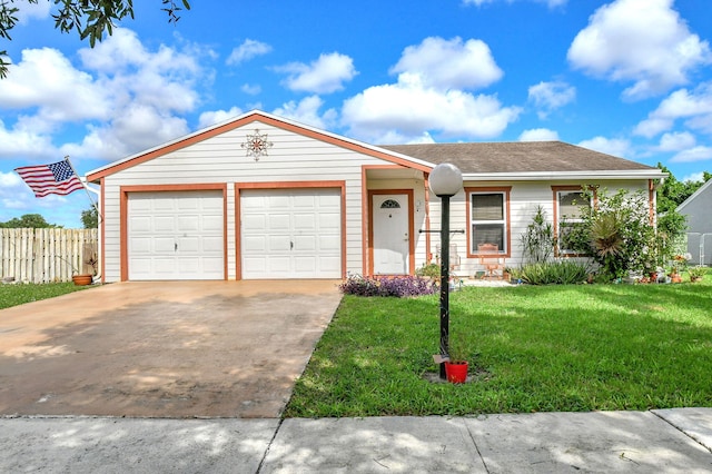 ranch-style house featuring a garage and a front lawn