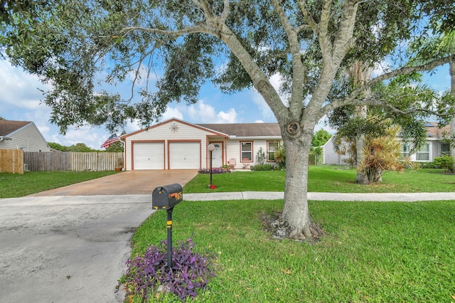 single story home featuring a garage and a front yard