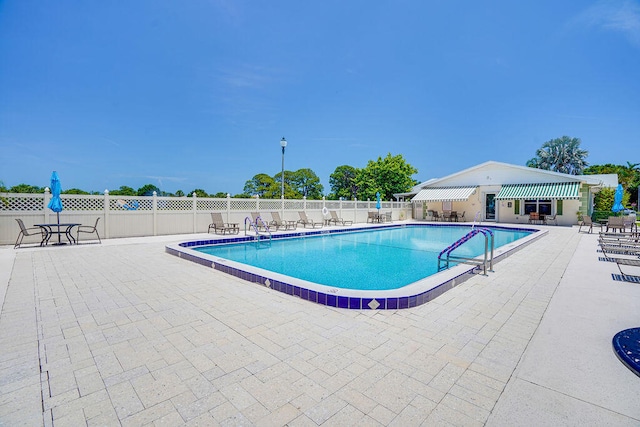 view of pool featuring a patio