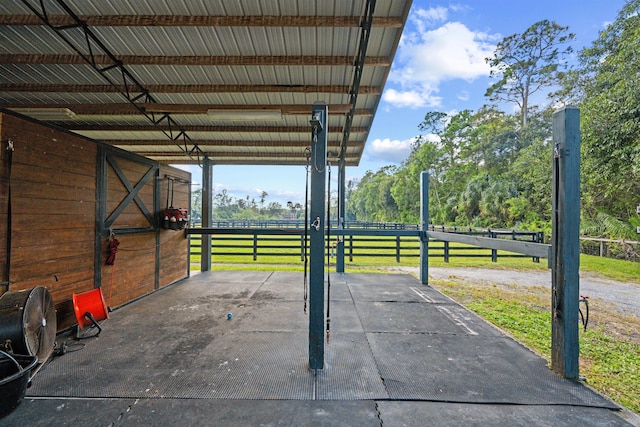 view of patio / terrace with a rural view and an outbuilding