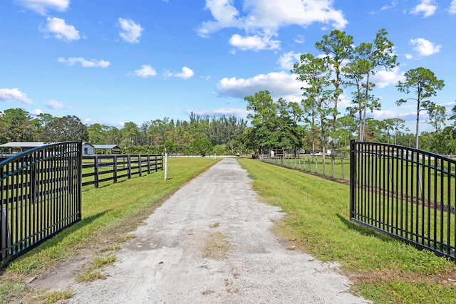 view of gate featuring a lawn