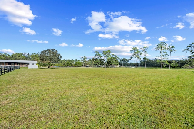 view of yard with a rural view