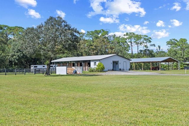 ranch-style house featuring a carport and a front lawn