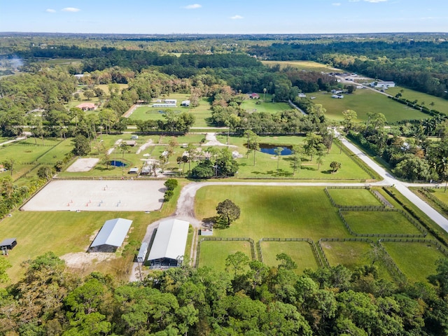 birds eye view of property with a rural view