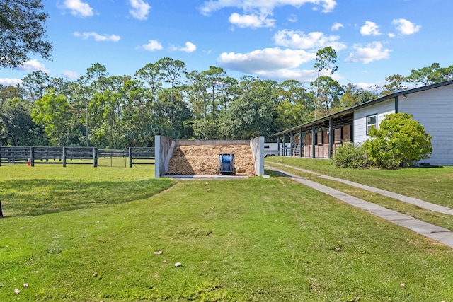 view of home's community with a yard