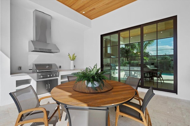 dining room with wood ceiling