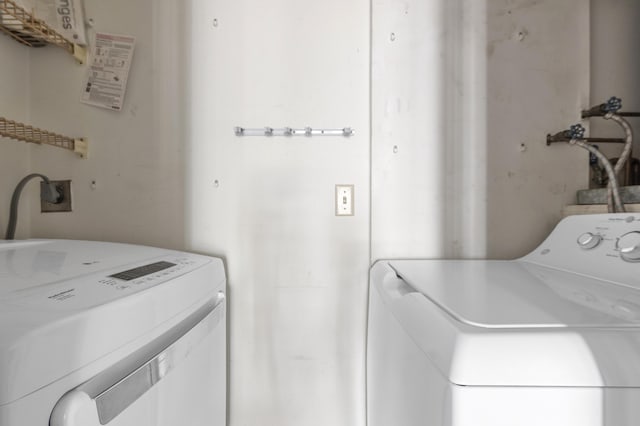 washroom with washer and clothes dryer