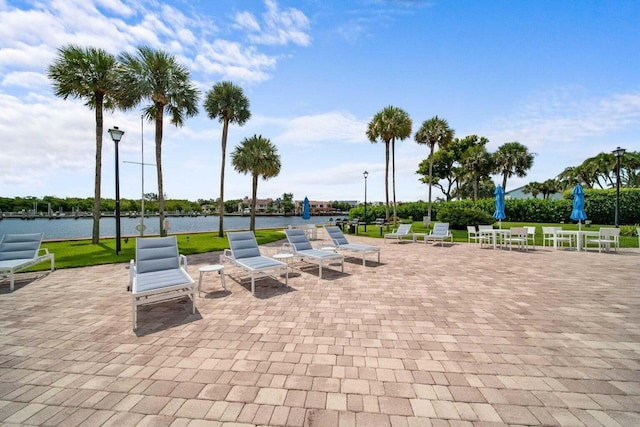 view of patio with a water view