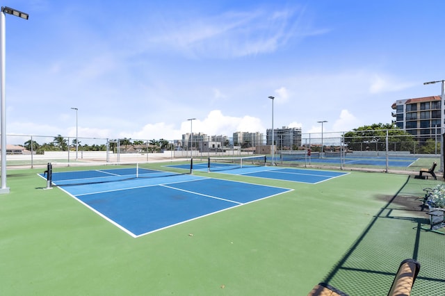 view of tennis court with fence