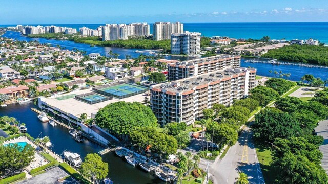 bird's eye view of a large body of water and apartment complex / building