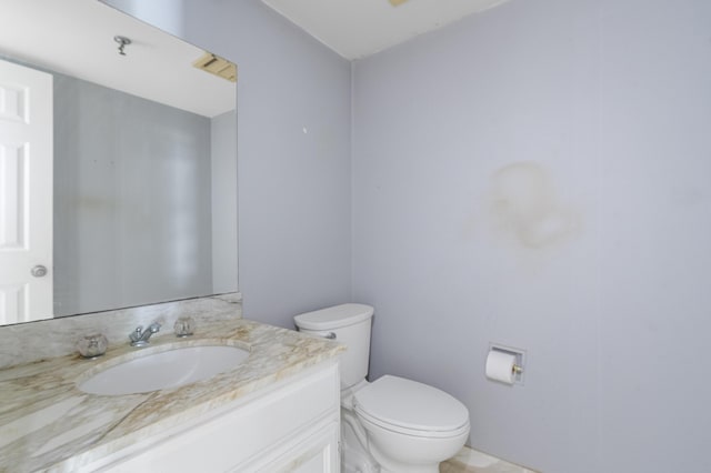 half bath with toilet and vanity