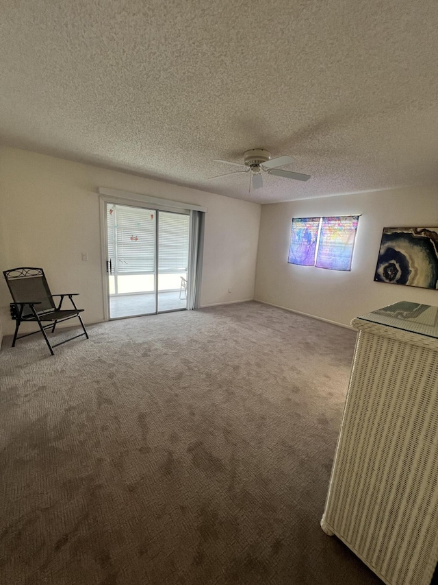 13 Lake Vista Trl Unit 205, Port Saint Lucie, FL 34952 - carpeted empty room featuring healthy amount of natural light, a ceiling fan, and a textured ceiling