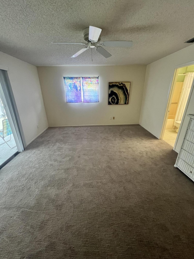 13 Lake Vista Trl Unit 205, Port Saint Lucie, FL 34952 - carpeted spare room featuring ceiling fan and a textured ceiling