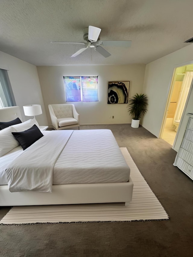 carpeted bedroom featuring a textured ceiling, ceiling fan, and ensuite bathroom