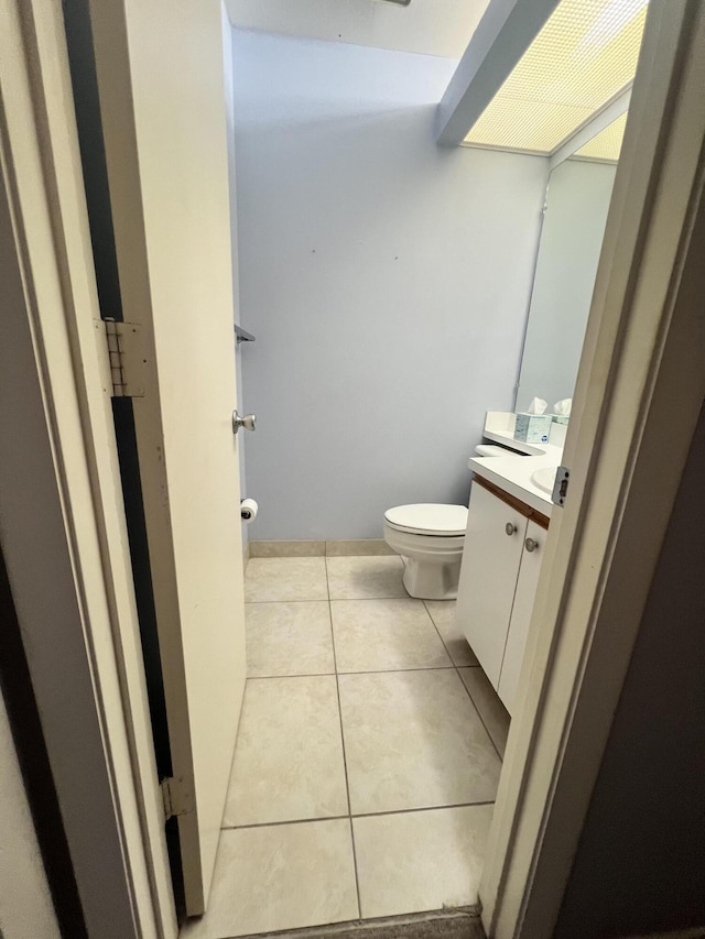 13 Lake Vista Trl Unit 205, Port Saint Lucie, FL 34952 - bathroom with toilet, vanity, and tile patterned floors