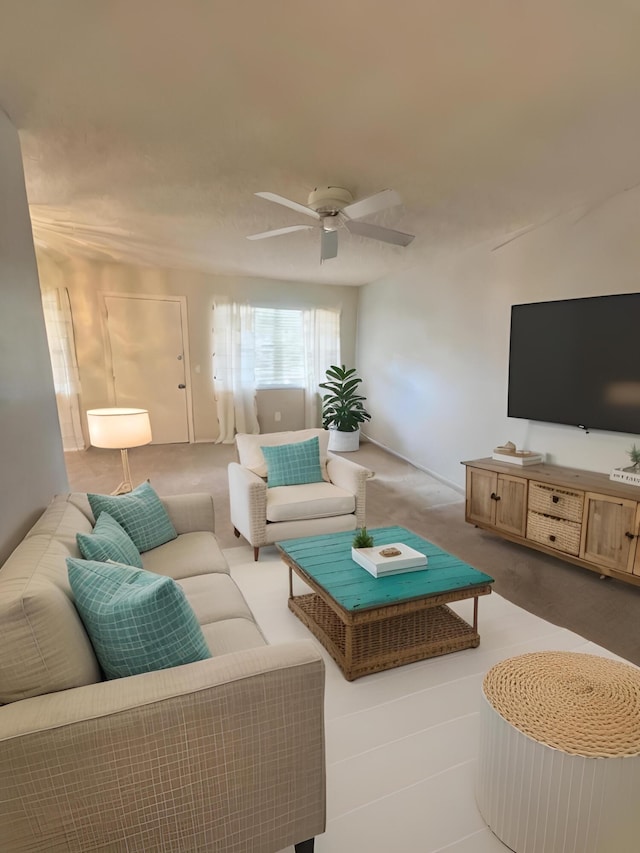 living room featuring carpet flooring and ceiling fan