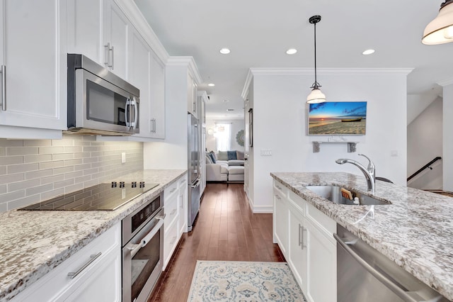 kitchen with white cabinets, dark hardwood / wood-style flooring, sink, and appliances with stainless steel finishes