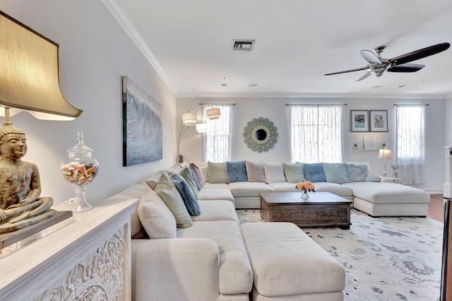 living room with ceiling fan, crown molding, and light hardwood / wood-style flooring