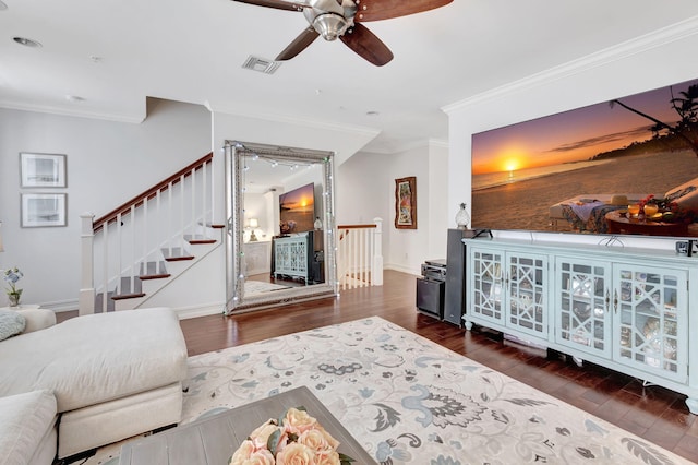 living room featuring ceiling fan, dark hardwood / wood-style floors, and ornamental molding