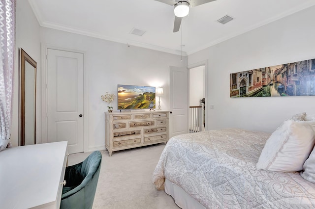 bedroom with ceiling fan, light colored carpet, and ornamental molding