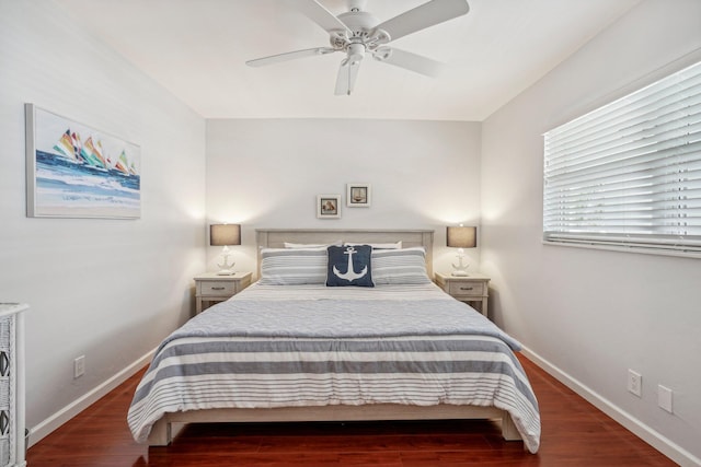 bedroom with ceiling fan and dark hardwood / wood-style flooring