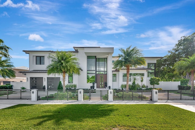 200 NE 6th St, Boca Raton, FL 33432 - view of front of house featuring a gate, stucco siding, a front lawn, and a fenced front yard