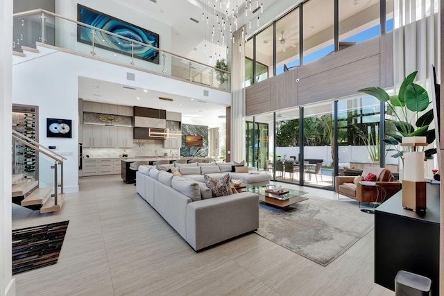 tiled living room featuring a towering ceiling