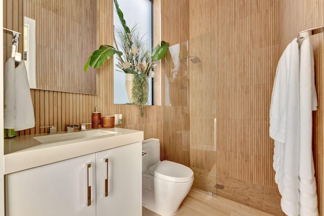 bathroom with vanity, toilet, and walk in shower