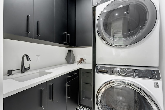 200 NE 6th St, Boca Raton, FL 33432 - washroom with cabinet space, a sink, and stacked washer and dryer