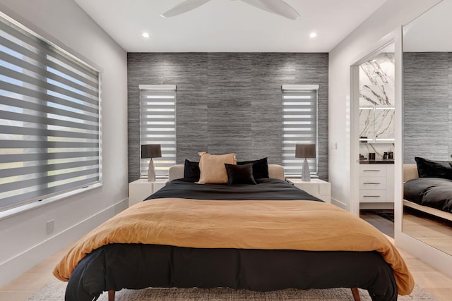 tiled bedroom with tile walls and ceiling fan