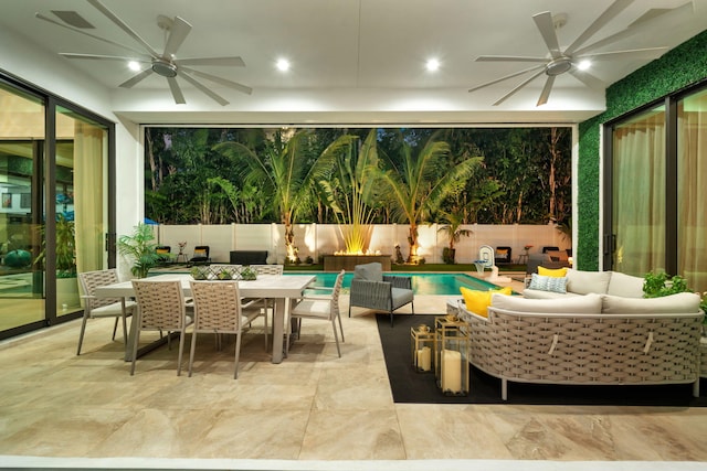 view of patio featuring a fenced in pool, an outdoor living space, and ceiling fan