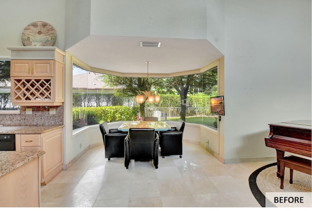 office featuring plenty of natural light and light tile patterned flooring