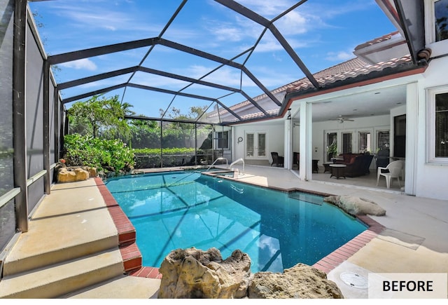 view of pool featuring ceiling fan, a patio area, glass enclosure, and french doors