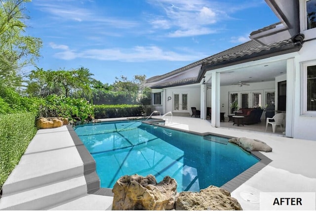 view of pool with french doors, a patio, and ceiling fan