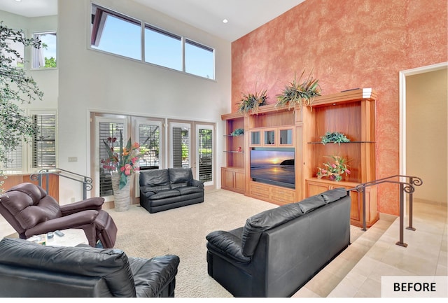 living room featuring light tile patterned floors, crown molding, and a healthy amount of sunlight