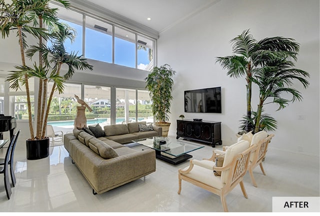 living room featuring a high ceiling and an inviting chandelier