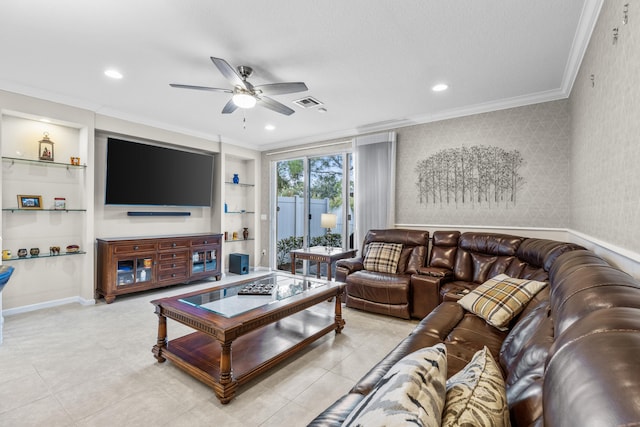 living room featuring built in shelves, ornamental molding, ceiling fan, and light tile patterned flooring