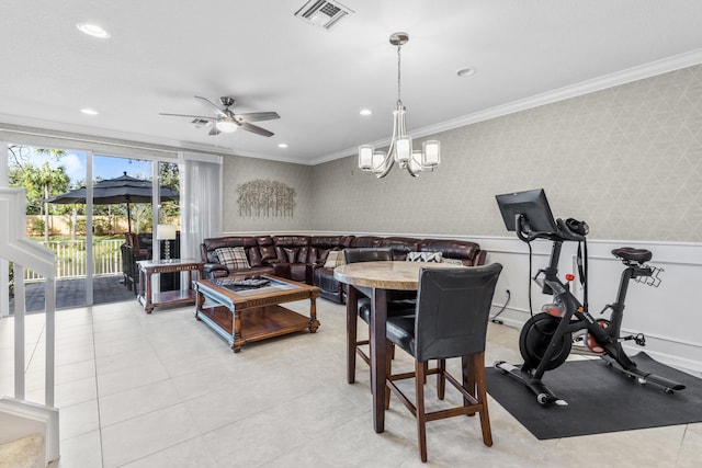 dining room with ornamental molding and ceiling fan with notable chandelier