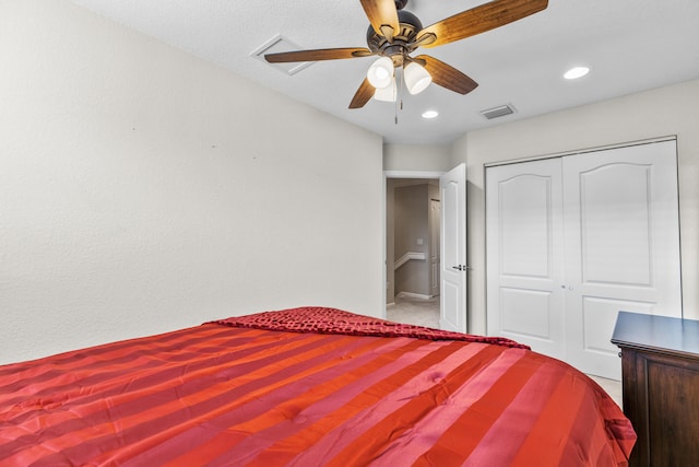 bedroom featuring ceiling fan and a closet