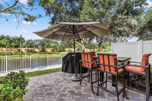 view of patio featuring a water view