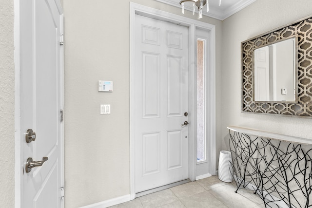 tiled entryway featuring ornamental molding