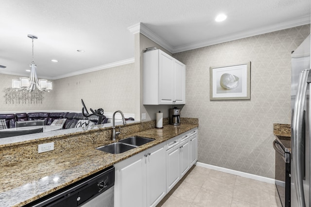 kitchen featuring white cabinets, dark stone counters, sink, and ornamental molding