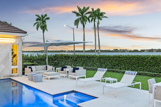 view of pool featuring a fenced in pool, a patio, and an outdoor hangout area